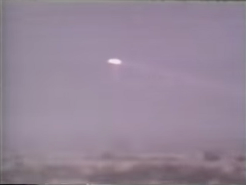 Screenshot of White Sands UFO Crash video shows a bright ovoid object.